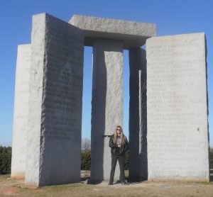 Tom McDyne at the GEORGIA GUIDESTONES. Complete with Freemason hand pose.