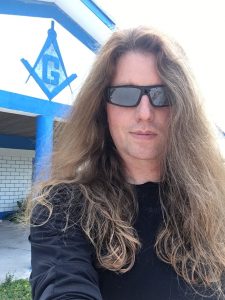 Tom McDyne on a remote island in the Caribbean. No less than three Freemasons buildings in the middle of nowhere. Completely normal. :)